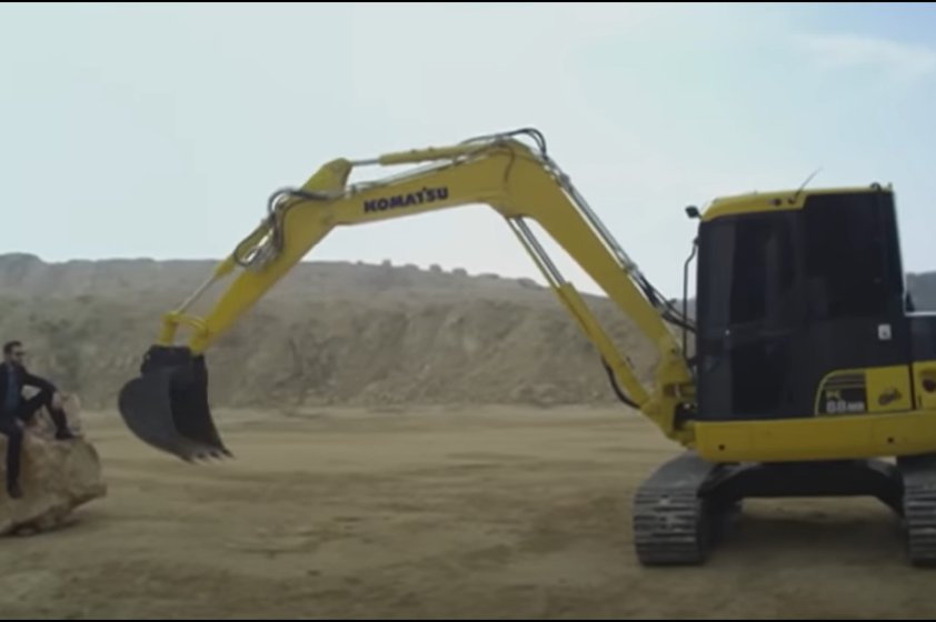 New Komatsu wheel loader and dump trucks in operation at the